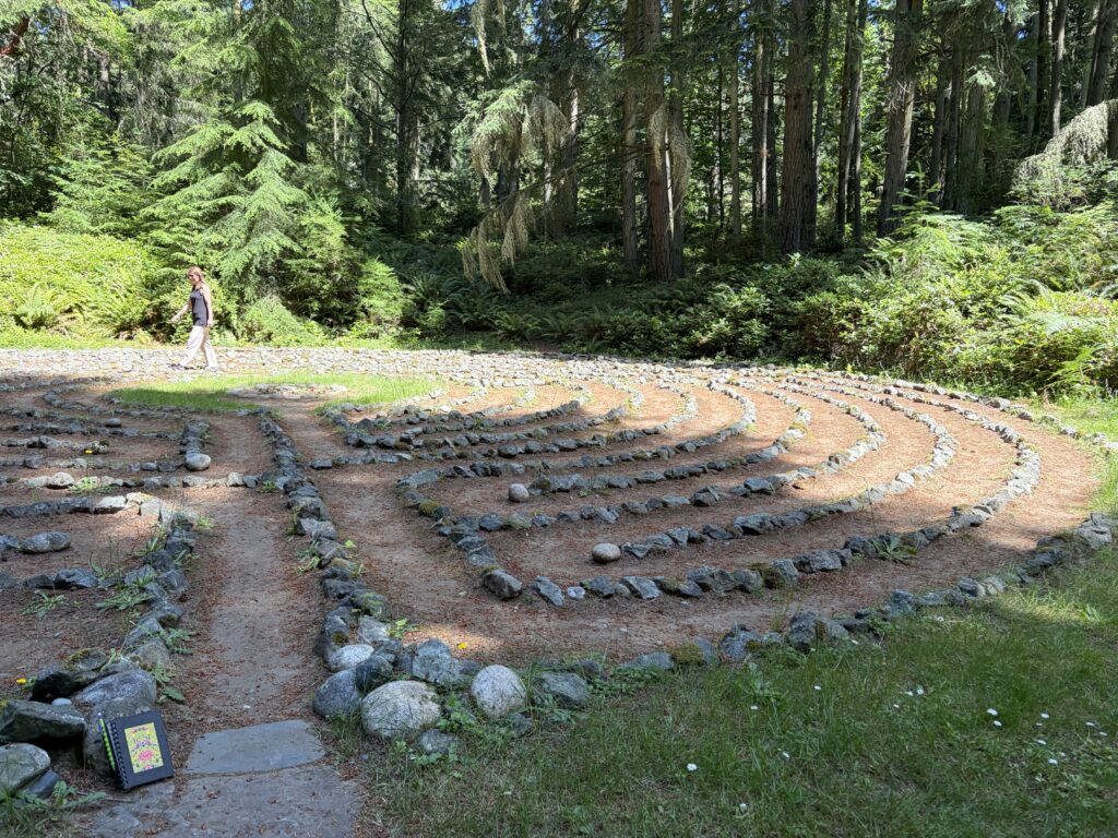 Rock-marked labyrinth, trees in the background at Whidbey Institute